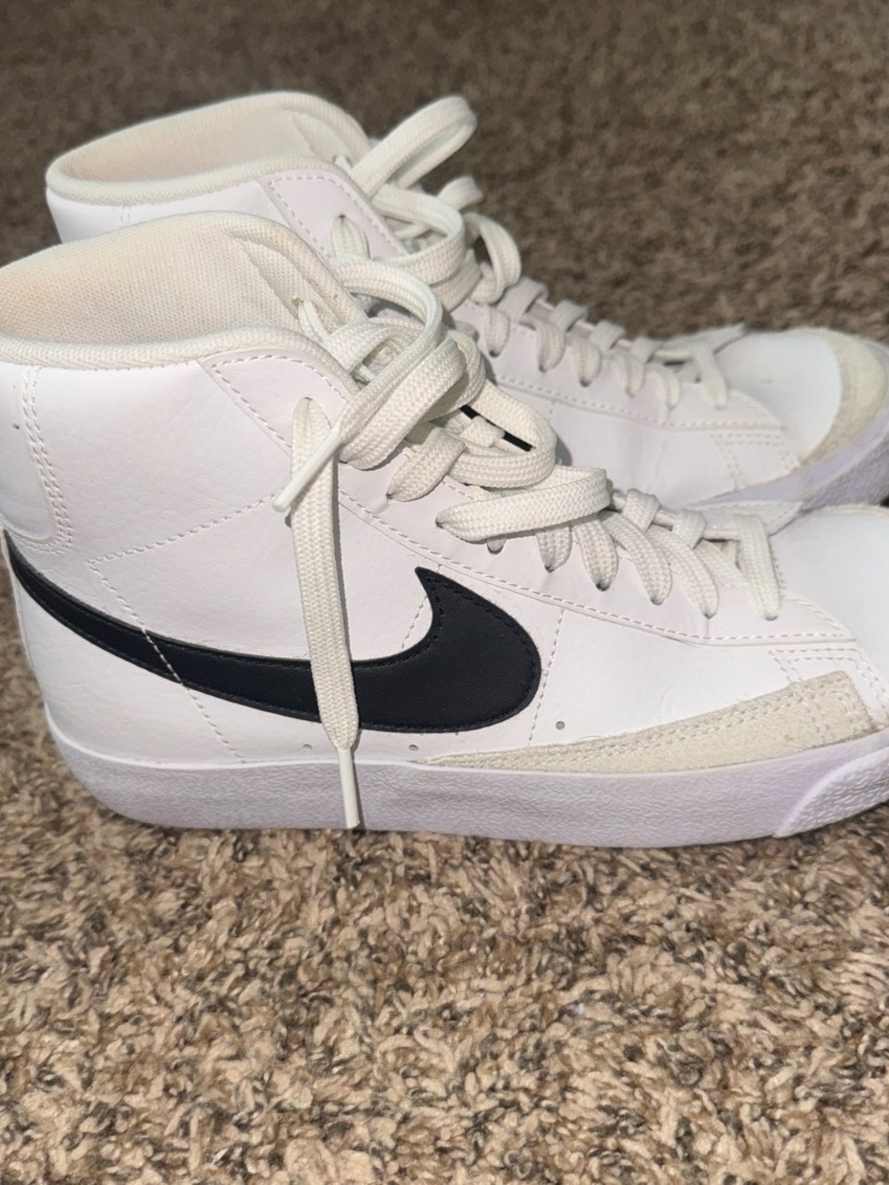 Nike Women's White High-Top Sneakers with Black Swoosh Accent